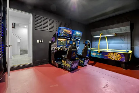 Arcade room with racing games and air hockey